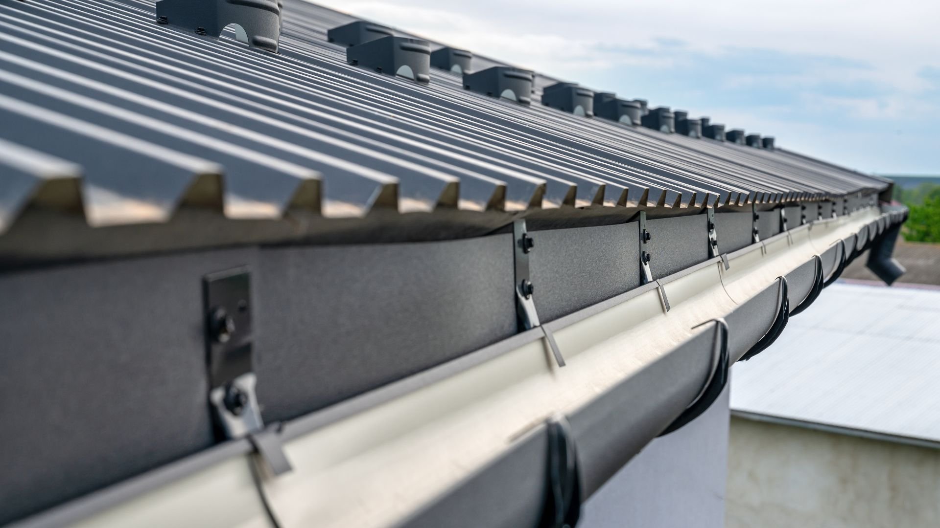 Close-up of modern roof with gutters and ventilation system
